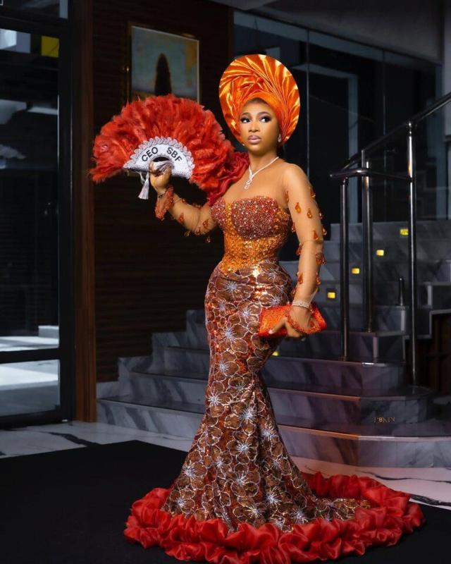 Orange & Copper Sequin Mermaid Asoebi with Red Ruffle Train | Nigerian Wedding Drama | OutfitLibrary