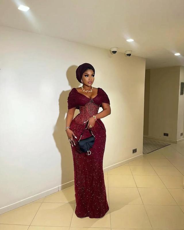 Wine Burgundy Sequin Asoebi with Sheer Corset Bodice & Dior Saddle Bag | Nigerian Wedding | OutfitLibrary