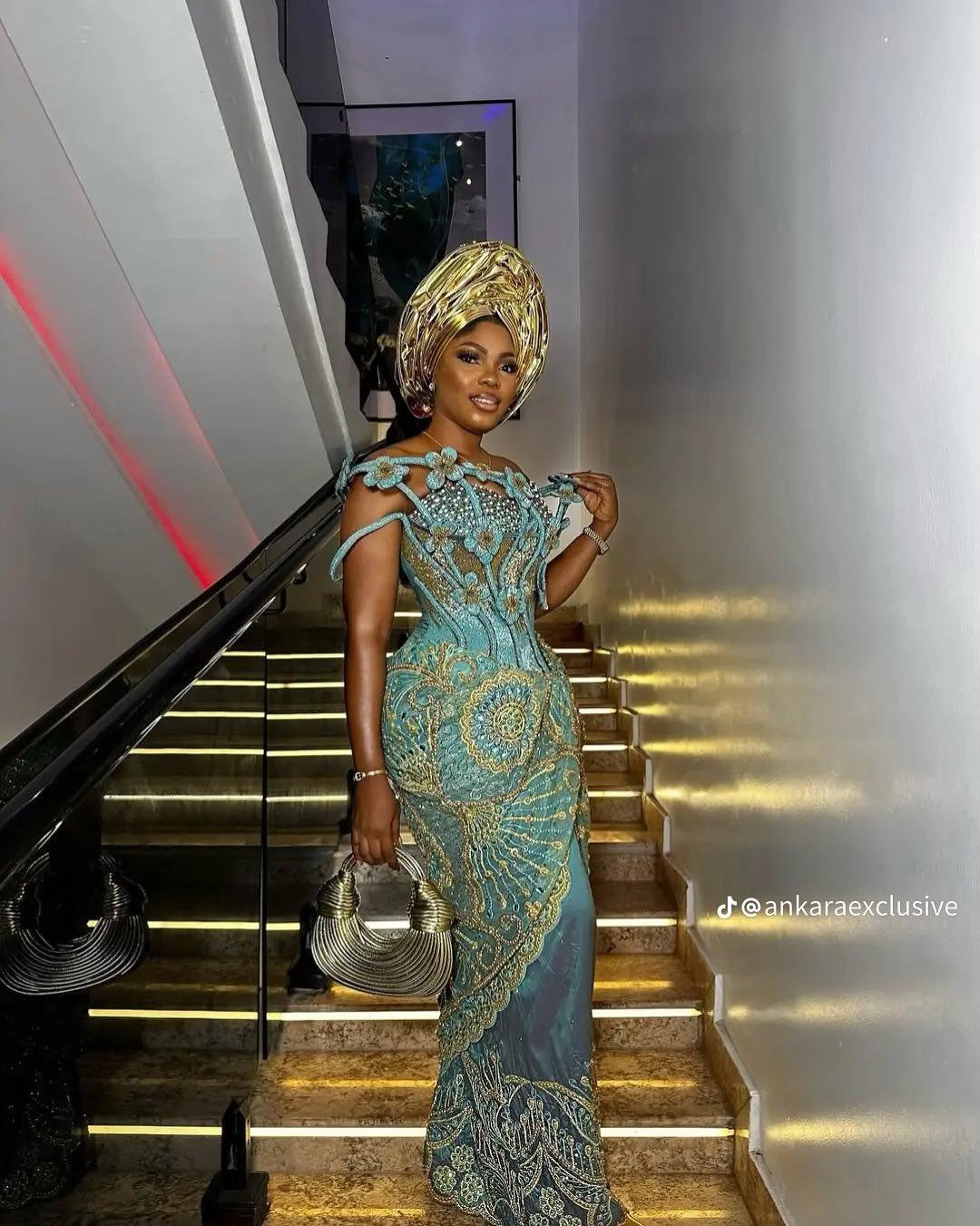 Teal & Gold Lace Mermaid Asoebi with 3D Floral Shoulder Detail & Metallic Bag | OutfitLibrary