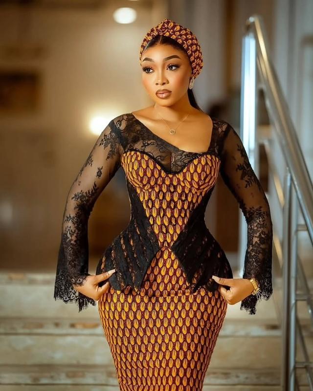 Amber Ankara Cowrie Print & Black Lace Fusion Asoebi with Bell Sleeves & Ankara Headband | OutfitLibrary