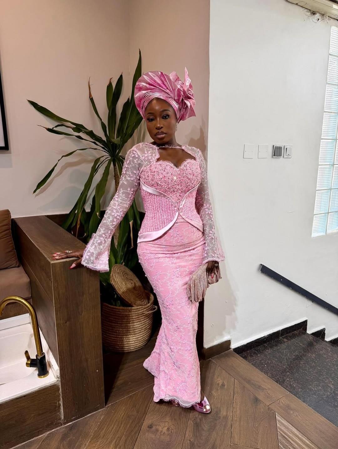 Baby Pink Lace Mermaid Asoebi with Beaded Corset, Lace Sleeves & Glove Clutch | OutfitLibrary