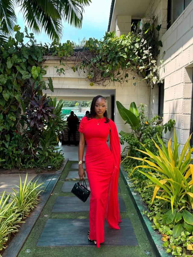 Red Minimal Crepe One-Shoulder Cape Asoebi with Black Micro Bag & Box Braids | OutfitLibrary