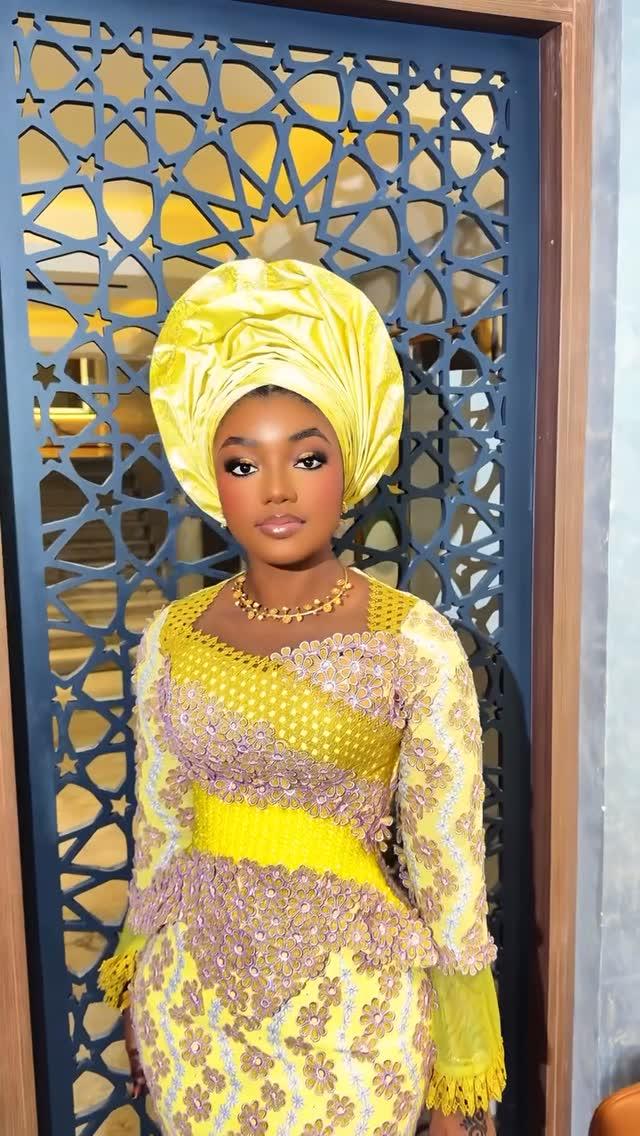 Yellow 3D Floral Lace Asoebi with Yellow Satin Gele in Arabesque Doorway Setting | OutfitLibrary