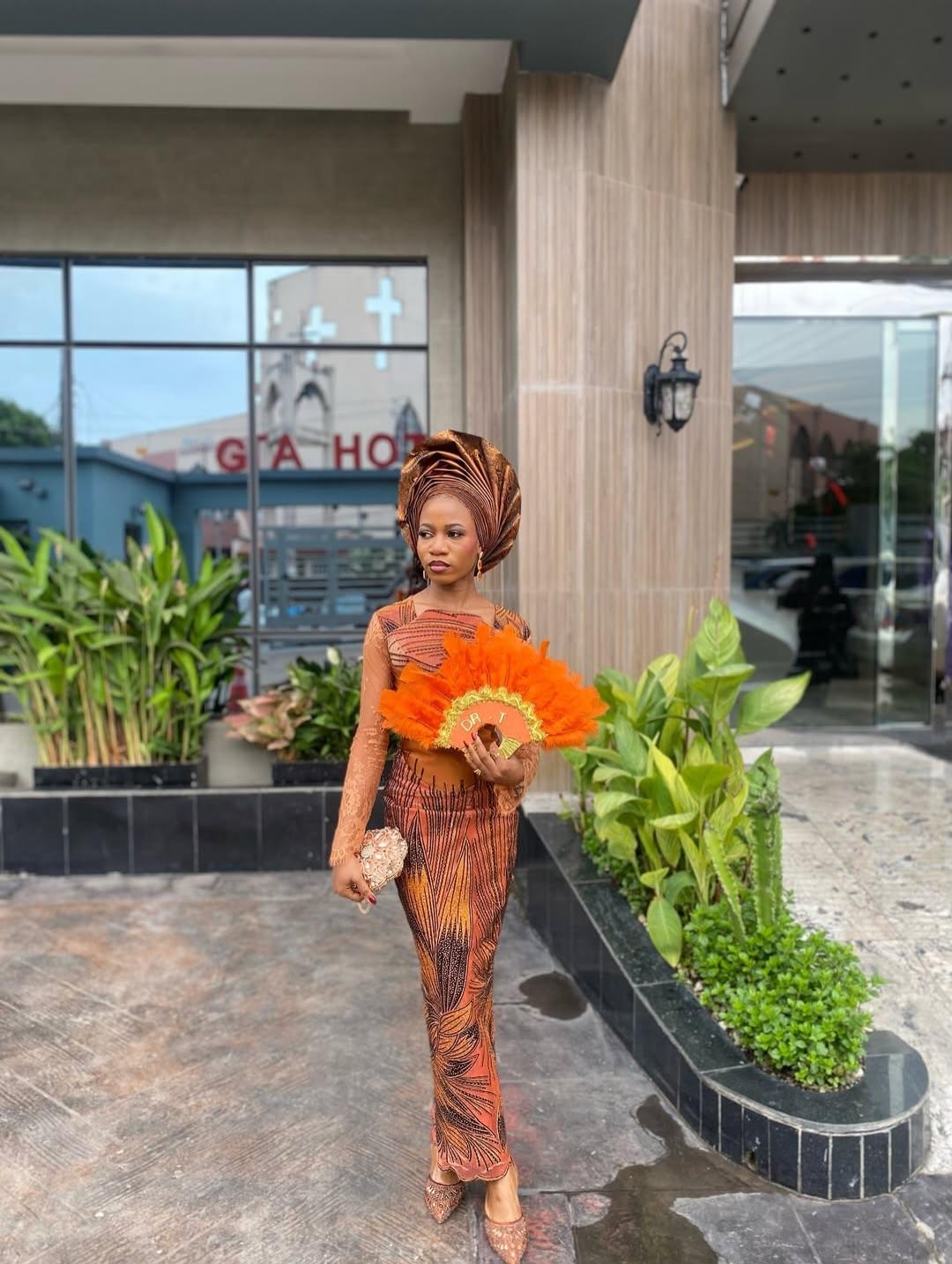 Orange Ankara Feather Print Asoebi with Orange Feather Fan & Lace Overlay Bodice | OutfitLibrary