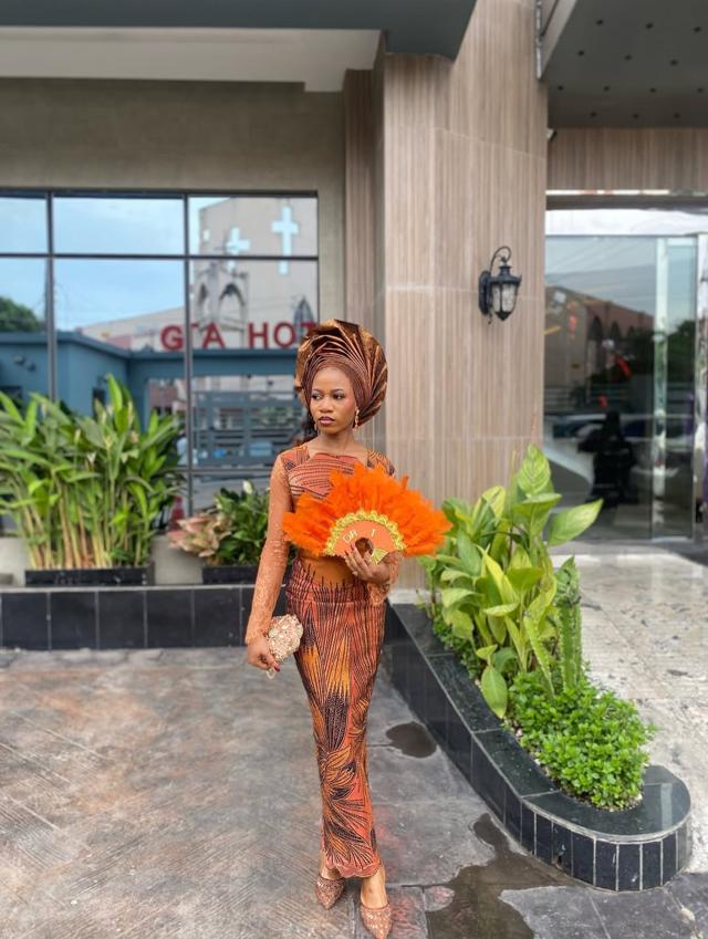 Orange Ankara Feather Print Asoebi with Orange Feather Fan & Lace Overlay Bodice | OutfitLibrary