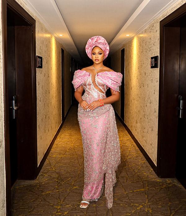 Victoria Uvo Stuns in Pink Aso Ebi with Dramatic Gele & Embellishments | OutfitLibrary.com
