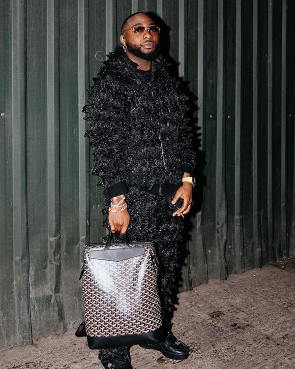 Davido in All-Black Textured Two-Piece with Statement Tote | OutfitLibrary.com