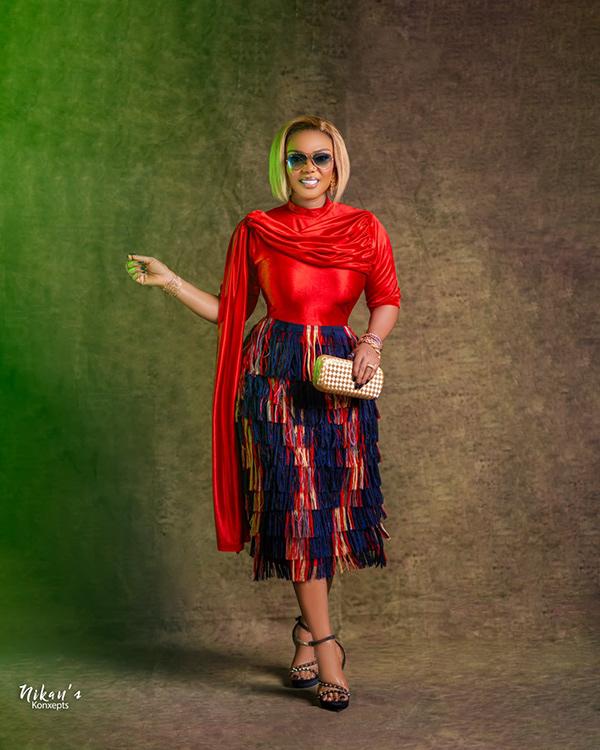 Iyabo Ojo Stuns in Red Cape Top & Multicolour Fringe Midi Skirt | OutfitLibrary.com