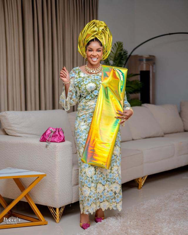 Iyabo Ojo Shines in Gold Gele & Blue Floral Lace Aso Ebi Iro and Buba | OutfitLibrary.com