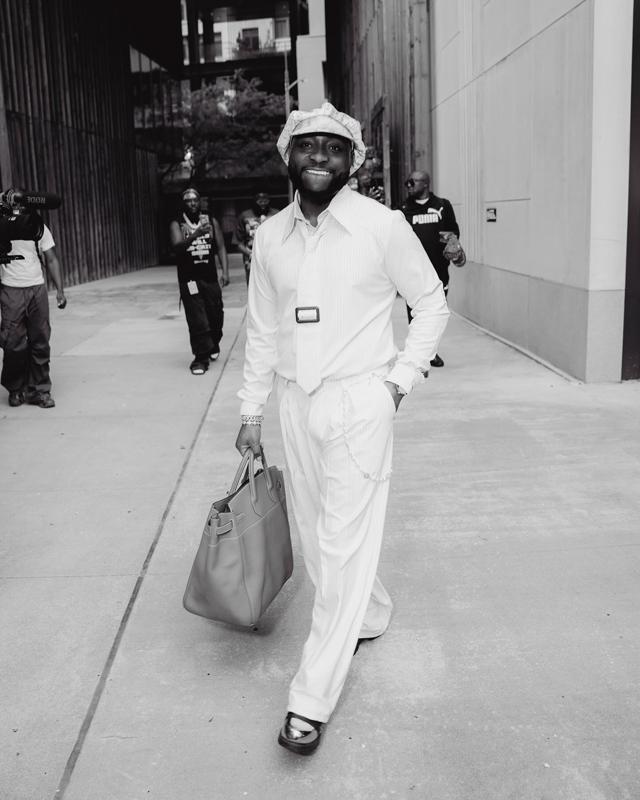 Davido in White Striped Relaxed Suit, Bucket Hat & Tote Bag Street Style | OutfitLibrary.com
