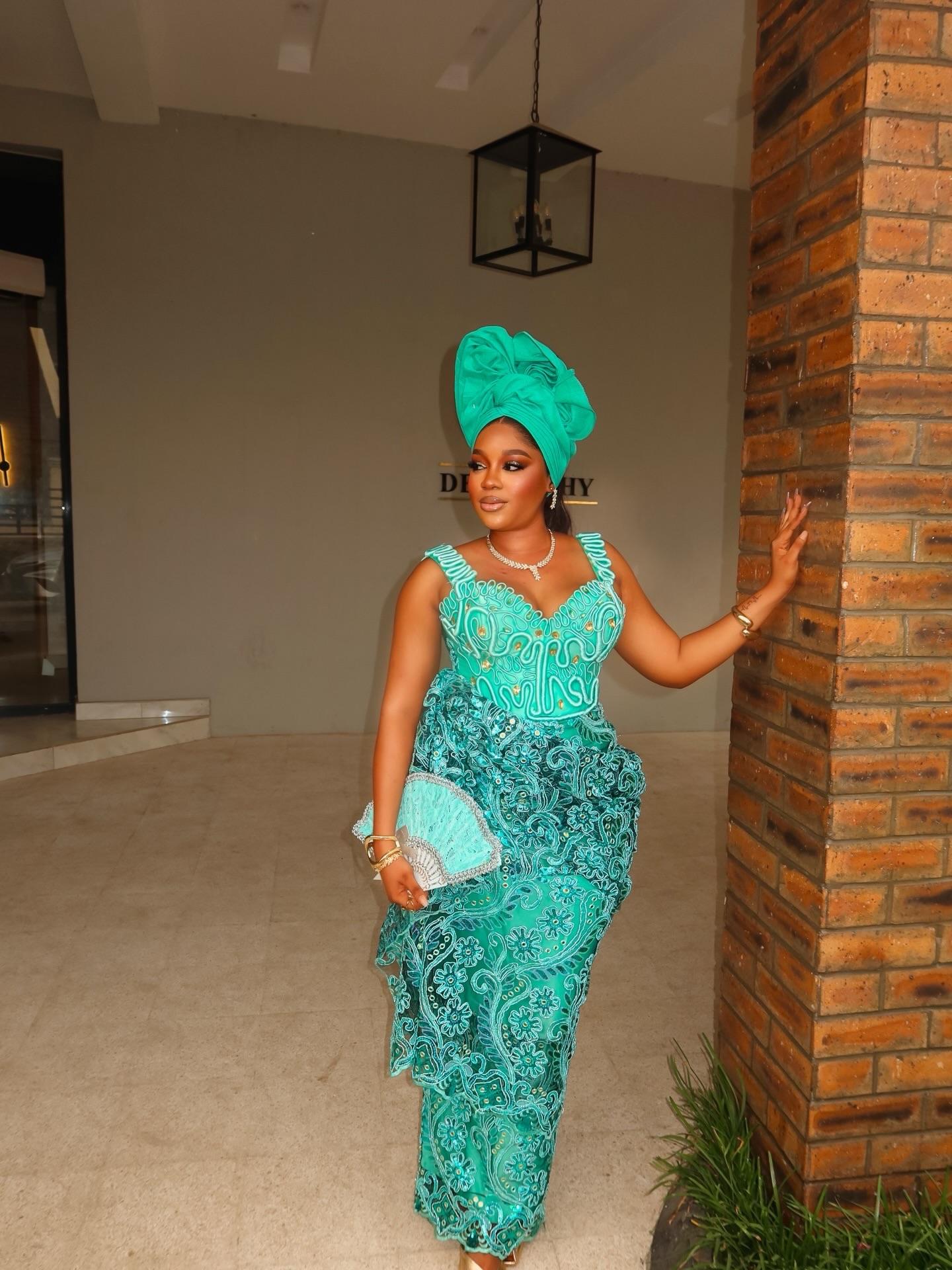 Vibrant Turquoise: Sculptural Corded Lace Gown & Matching Hand Fan |OutfitLibrary