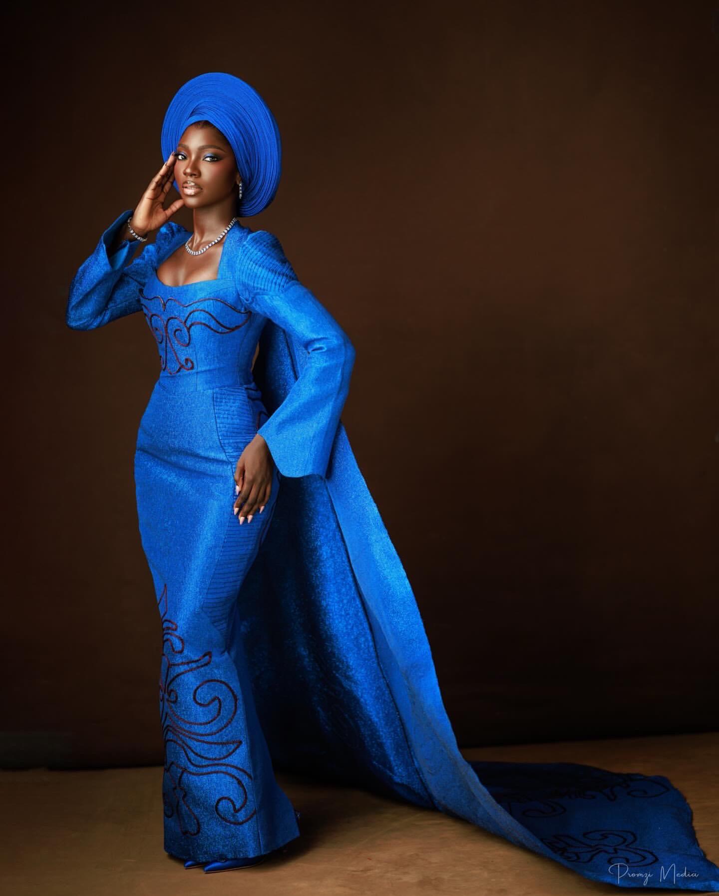 Azure Radiance: Royal Blue Architectural Gown with Burgundy Scrollwork |OutfitLibrary