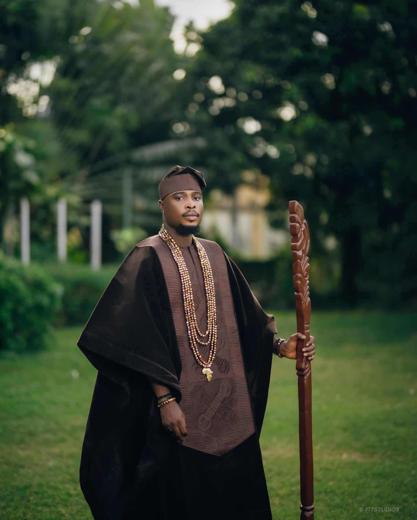 Earthly Majesty: Chocolate Brown Agbada with Bronze Beads & Traditional Staff |OutfitLibrary